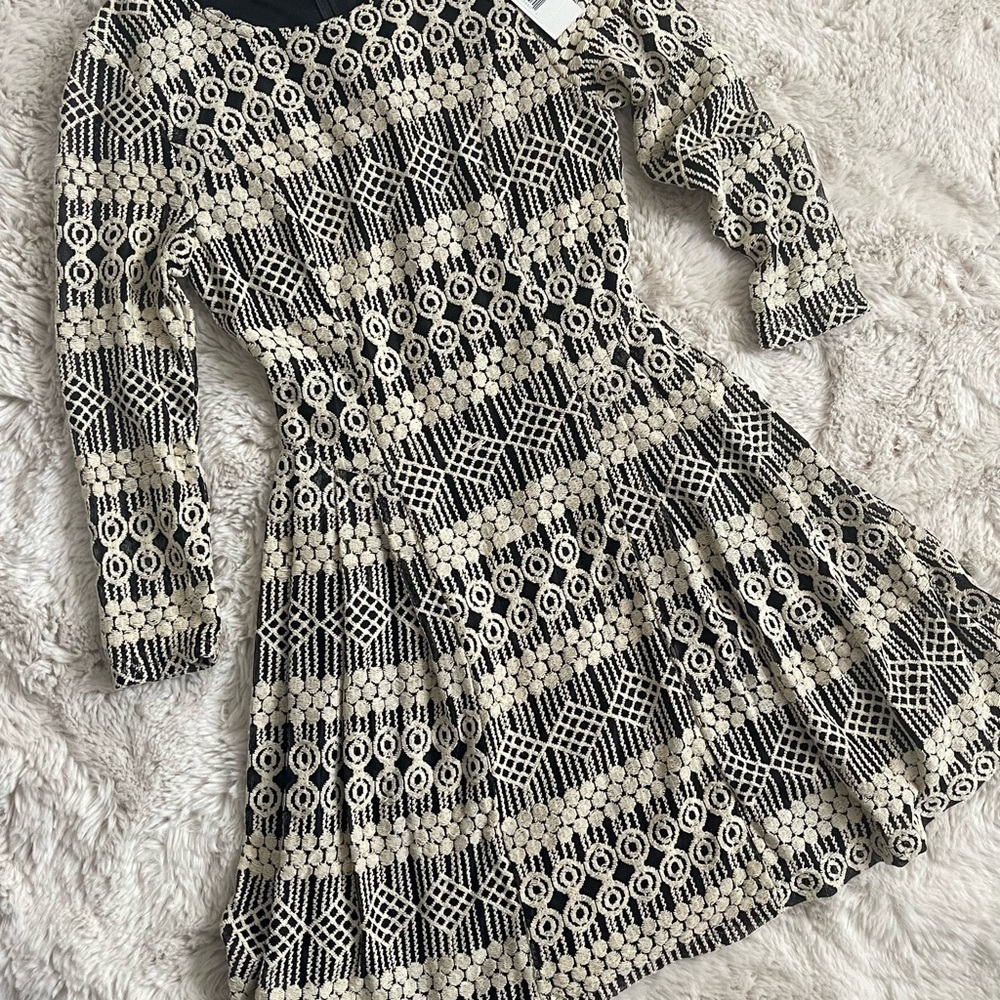 Elegant Black and Cream Patterned Dress